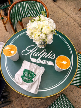 Ralph&rsquo;s Coffee branded table with two coffee cups in caf&eacute; interior, Palo Alto, California, USA