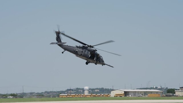UH-60 Black Hawk Military Helicopter Taking Off With Door Machine Gunner