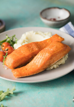 Grilled salmon fish fillet and green salad