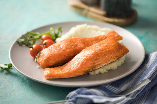 Grilled salmon fish fillet and green salad