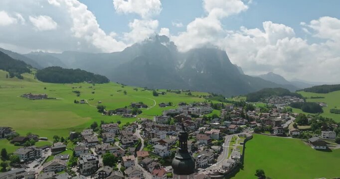 Aerial of Schlern mountain seen from Castelrotto village, Dolomites, Italy
