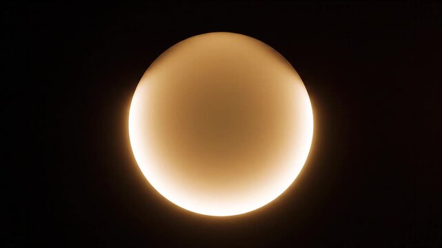 Glowing circular light fixture against a dark background