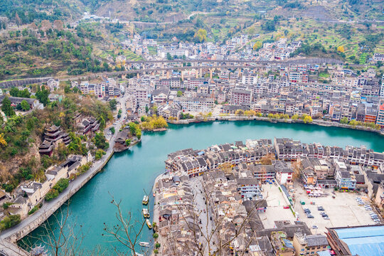 A bird's-eye view of Qinglong Cave in Zhenyuan Ancient Town, Guizhou, China, at dawn from Shiping Mountain.