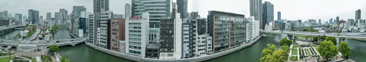 Fototapeta premium Aerial view of Osaka bridge and river with urban skyline and cityscape