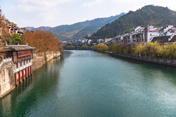 Obraz premium Panoramic Winter Sunset Scenery of Zhenyuan Ancient Town in Qiandongnan, Guizhou, China
