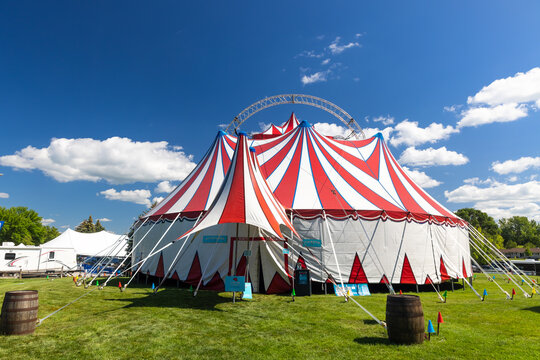 Red and white striped circus tent big top festival by Circus Kirkus company.