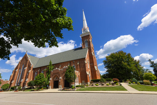St Lorenz Lutheran red brick church steeple reaching blue sky