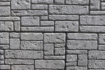 Gray stone wall pattern forming a textured surface © SNEHIT PHOTO