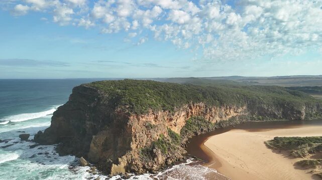 Princetown Beach, Victoria, Australia: 4K aerial drone footage of Gellibrand River mouth, sandy beach, ocean waves, forest, cliffs and coastal landscape. 
