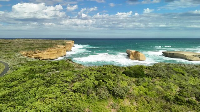 Sherbrook River Beach, Great Ocean Road, Port Campbell, Victoria: 4K aerial drone footage of river mouth, sandy beach, coastline and coastal cliffs near Thunder Cave and Mutton Bird Island