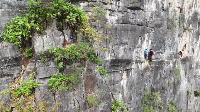  Hardcore Rock Climbing on Steep Karst Wall, Team with Rope Systems, Aerial Drone