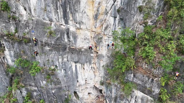  Technical Rock Climbing on Karst Tower, Climbers Placing Gear and Using Ropes
