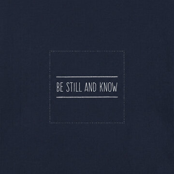 "Be Still and Know" christian bible verse on dark navy blue background