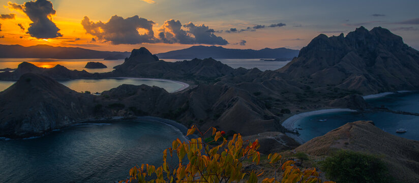 Stunning high-angle vista of the iconic multi-bay coastline and hills of Padar Island, Indonesia