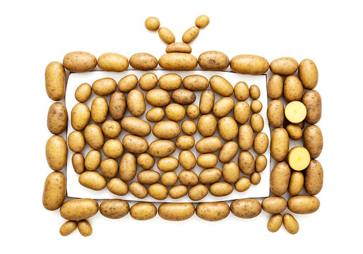 Creative television screen shape formed by arranged fresh potatoes on a white background