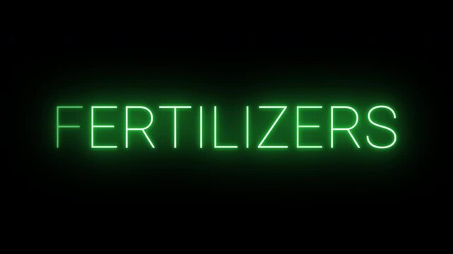 Flickering neon green glowing fertilizers sign animated black background.