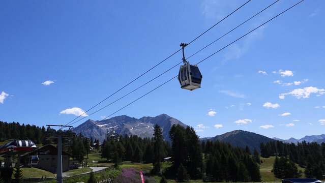 Cable Car Gondola Ascending Over the Italian Alps in Piedmont Summer