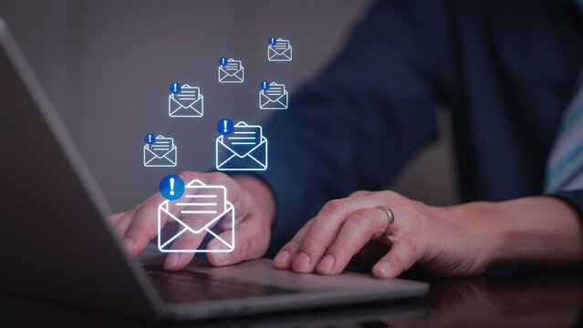 Email security cyber threat threat detection phishing spam inbox laptop businessman Businessman using laptop with email security for cyber threat