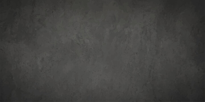 A dark vintage grunge blackboard background texture with a weathered black stone surface and rough aged gray concrete wall pattern for a blank textured frame backdrop