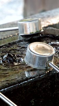 Traditional Japanese Temizuya Water Purification Fountain at Oyama Shrine in Kanazawa