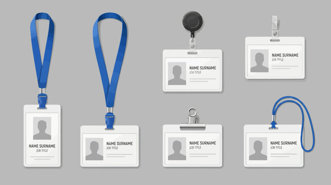 Collection of various employee ID cards with lanyards and clips on a gray background