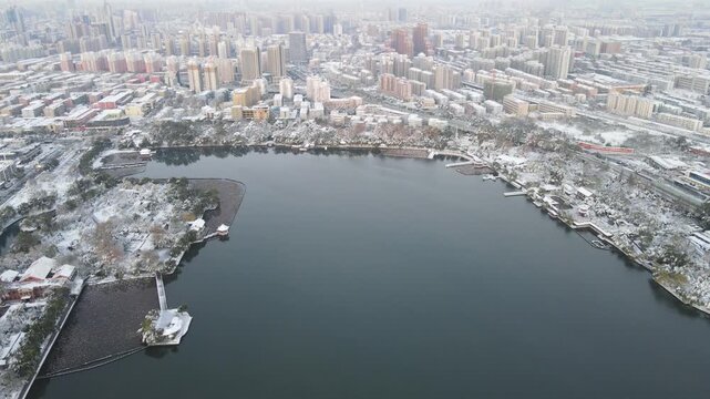 Snowy Aerial View of Xuanwu Lake and Nanjing City Skyline