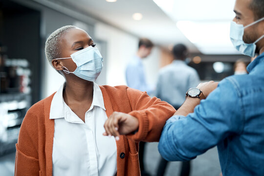 Business, face mask or people at event with elbow bump, greeting or virus protection in conference safety. Hello, health or employees with regulations, disease prevention or pandemic rules at seminar