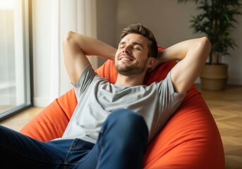 Fototapeta premium Man enjoying relaxation with arms stretched wide on a couch