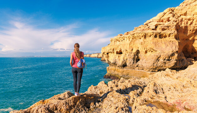 contemplative woman admiring the wild coastal beauty of algar seco