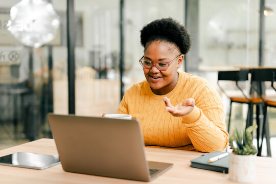 Woman video calling on laptop for remote work