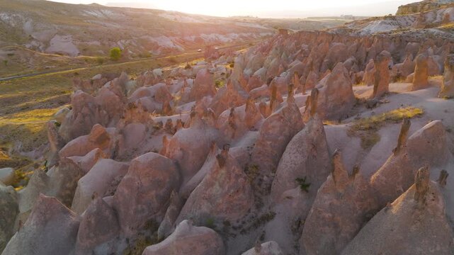 Goreme, Nevsehir, Turkey. Serene evening view of Devrent Valley with mystical rock formations and peaceful atmosphere during sunset meditation hours.. Aerial View