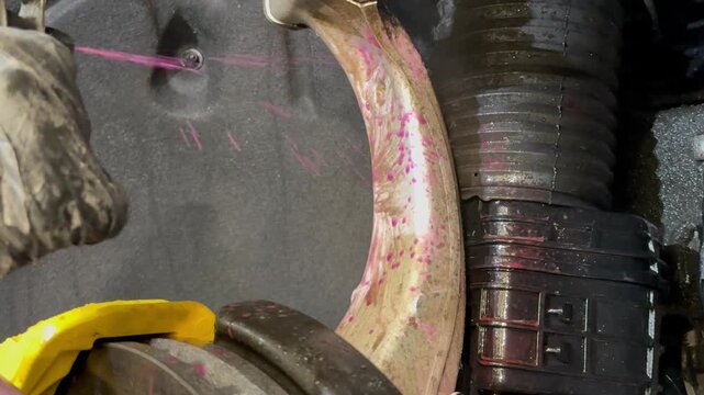 The process of washing the suspension, the underbody of the car with a chemical composition and a brush at the car wash. Washing the suspension of the car from reagents and contaminants using brush.  