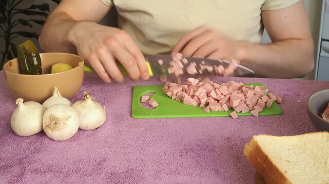 a man cutting ham for breakfast