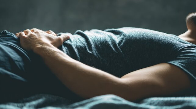 Man resting peacefully lying down on bed feeling relaxation, comfort, and serenity. The image portrays a sense of relaxation and inner peace