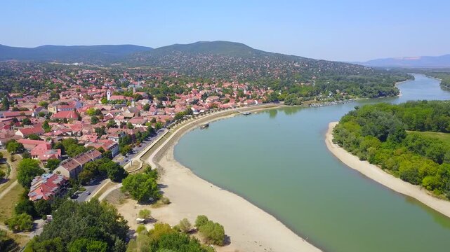 Drought summer of 2022, very low water level at Danube in Hungary, Szentendre with yellow burnt grass and withered trees
