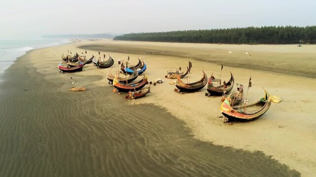 Traditional Bangladeshi Fishing Sampans Parked on a Deserted Tropical Coastline
