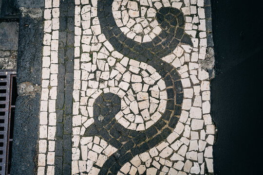 Portuguese pavement with wave pattern made from calcada stones