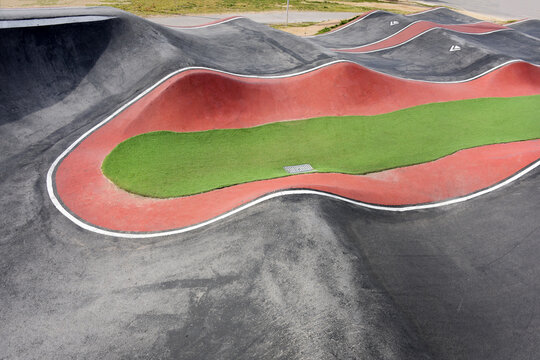 Coastal pump track with asphalt waves for biking and skate sports
