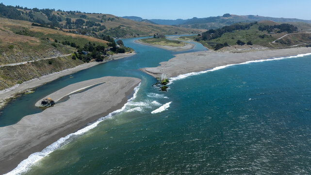 Wide drone shot of Russian River mouth flowing into Pacific Ocean