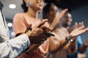 Fototapeta premium The approval of our peers push us forward. Shot of a group of businesspeople clapping during a meeting in a modern office.