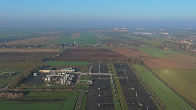 Aerial perspective of the groningen gas field, the largest natural gas field in europe. Industrial mining infrastructure in slochteren, netherlands