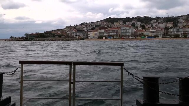 Stepping onto ferry deck with scenic view of Marmara Sea and Prince Islands in Istanbul slow motion