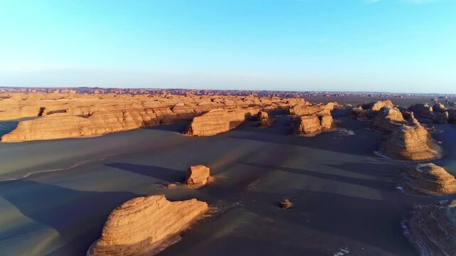 Aerial Sunset View of Desert Yardang Rock Formations