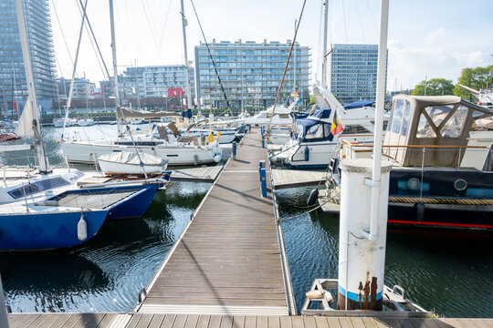 Harbor in Ostend, Belgium and ships, yachts, buildings, sea.
