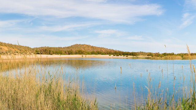 UZBEKISTAN - AYDAR LAKE WITH DESERT SHORE AND CALM WATER - THIS SCENIC DESTINATION ATTRACTS TRAVEL, TOURISM AND NATURE PHOTOGRAPHY IN CENTRALASIA