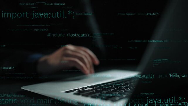 A close-up view of a hand typing on a laptop keyboard with Java code displayed, showcasing a modern tech workspace and creative programming environment. Xenic