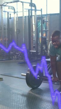 Vertical video: Man gripping barbell deadlifting,purple wave overlay moving showing fitness power