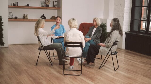 Talks with professional psychologist, senior ladies visiting group therapy. Mutual support group for mature women, discussing problems of health in old age, save female beauty in menopause period
