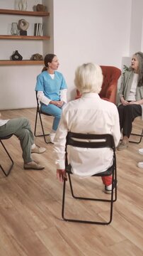Group of women visiting therapy session with psychologist, discussing aging. Mature ladies talking about mental and body health after 60, save natural female beauty, consultation with endocrinologist