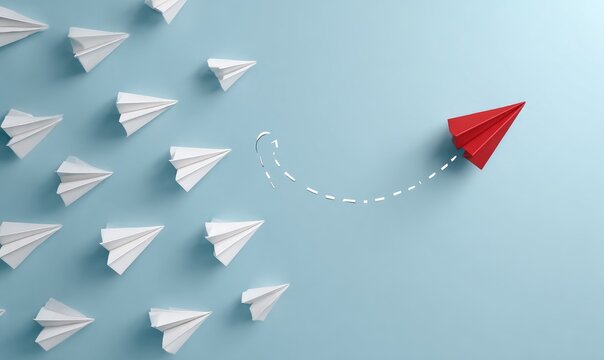 Red paper airplane deviates from a flock of white ones